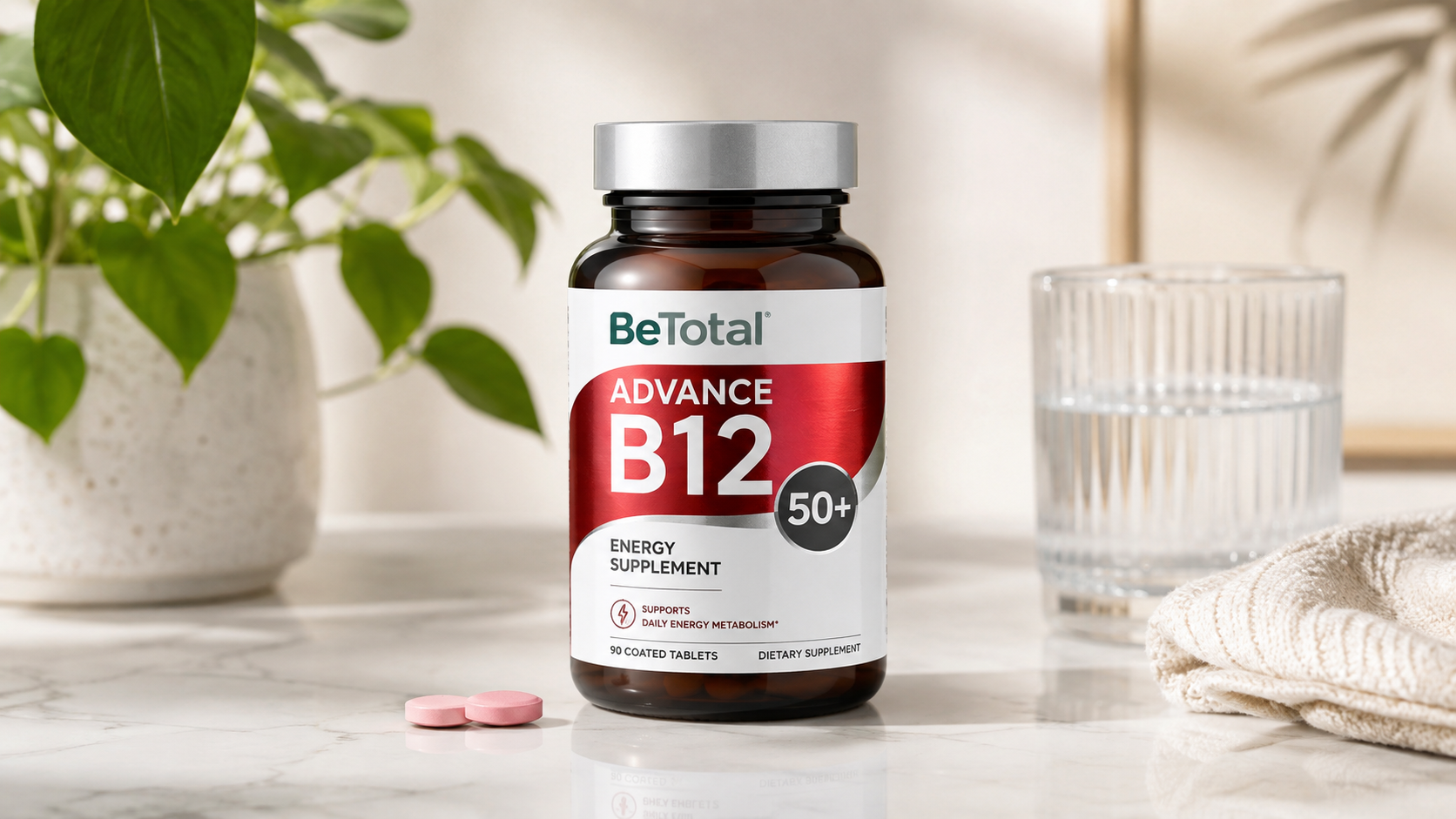 BeTotal Advance B12 50+ energy supplement bottle with tablets, water glass, and plant in a bright wellness setting.