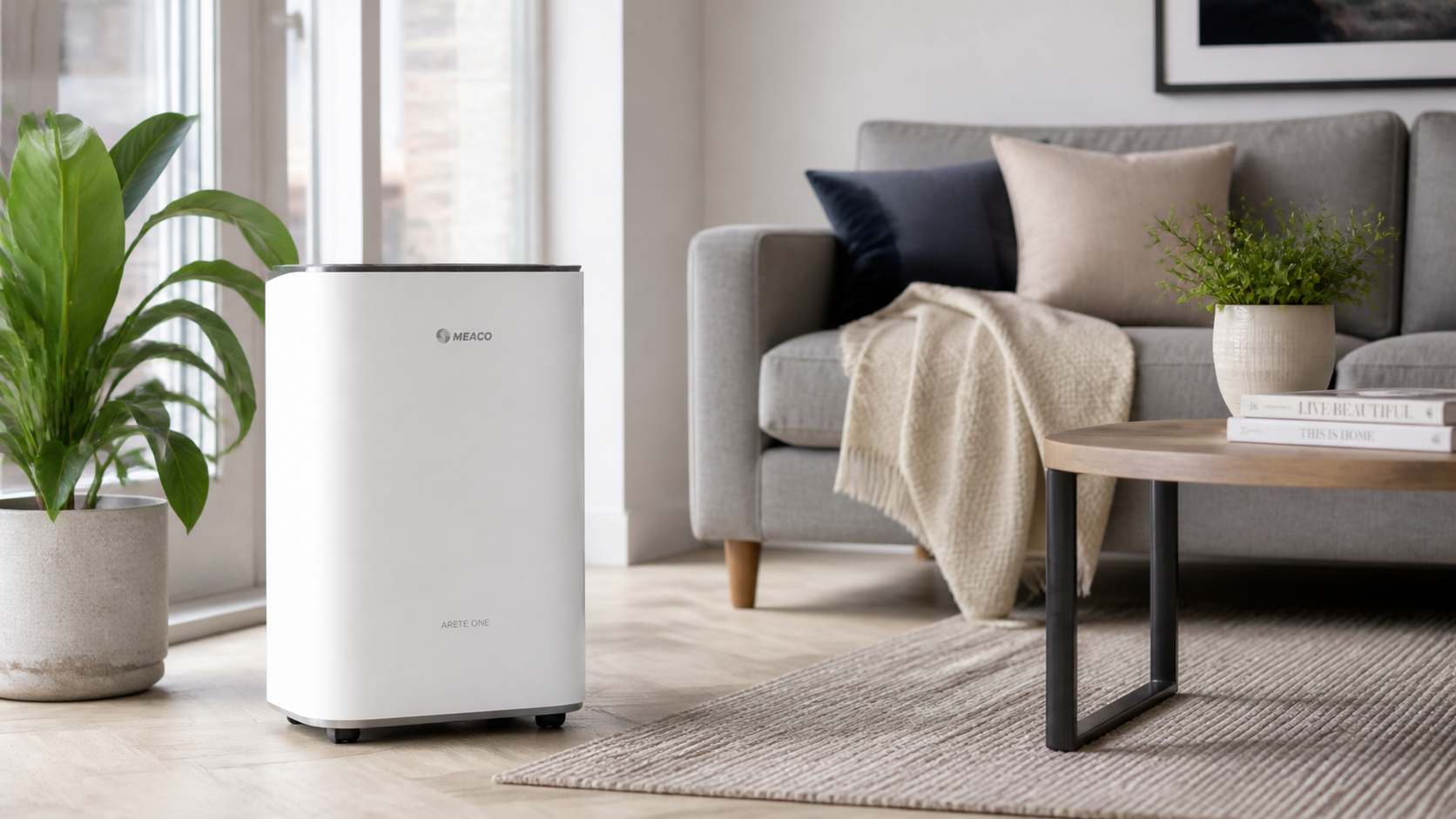 Meaco Arete One Dehumidifier unit displayed in a modern home living room setting